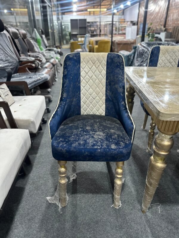 Luxury navy-blue and cream velvet dining chair with gold-painted legs, available at Islamabad Auctioneers.