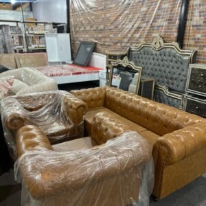 Modern brown Chesterfield sofa set with tufted design offered by Islamabad Auctioneers.